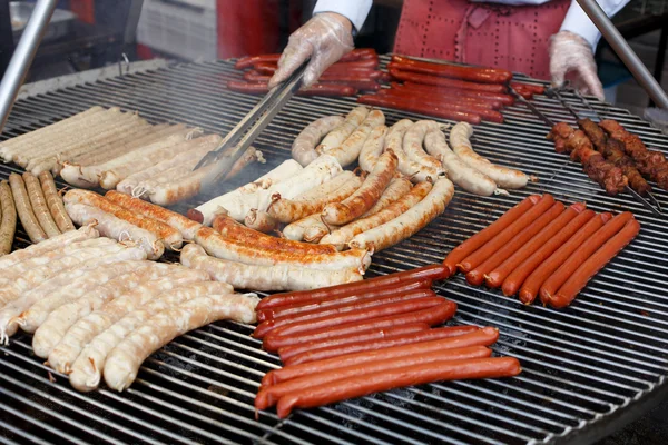 Street fast food, grilled sausages at bbq