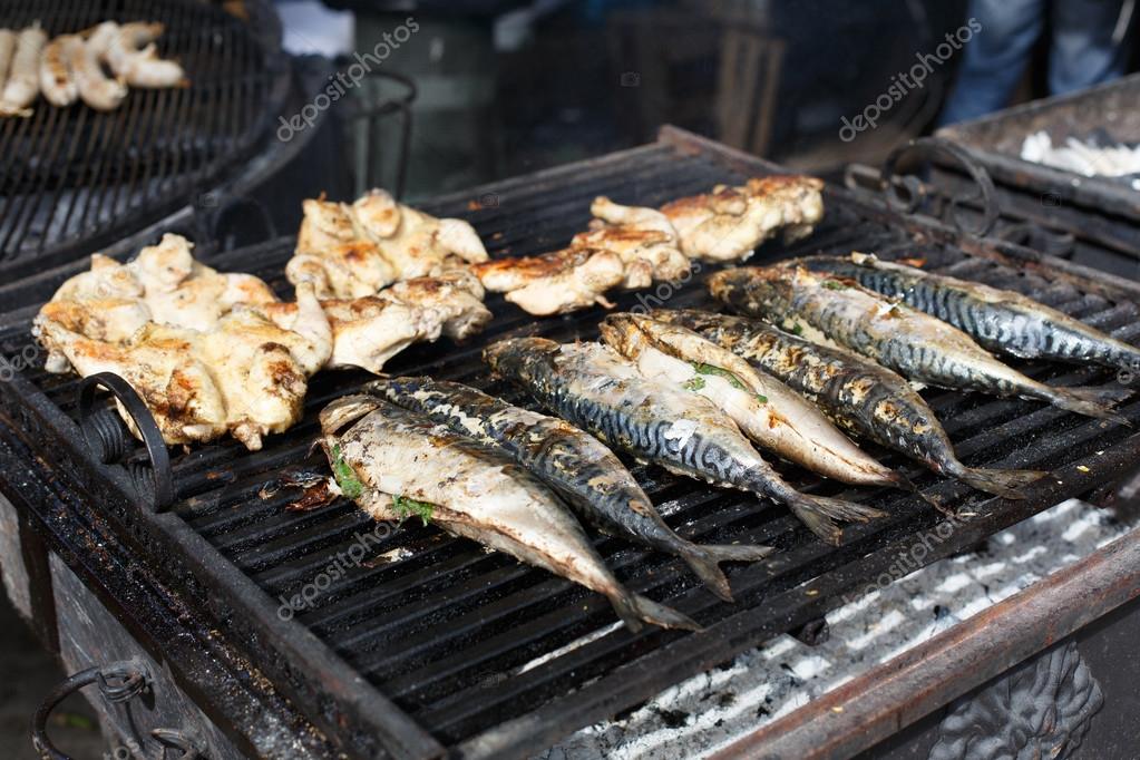 Fish mackerel and chicken tabaka grilled at bbq — Stock Photo