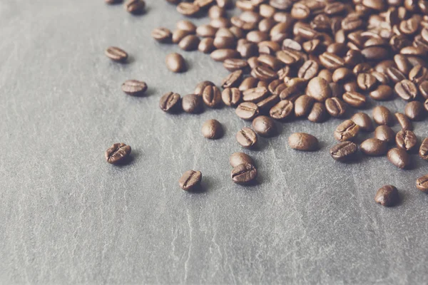 Coffee beans on stone with copy space, background — Stock Photo, Image
