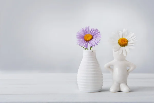 Beautiful flowers aster and daisy in vases — Stock Photo, Image
