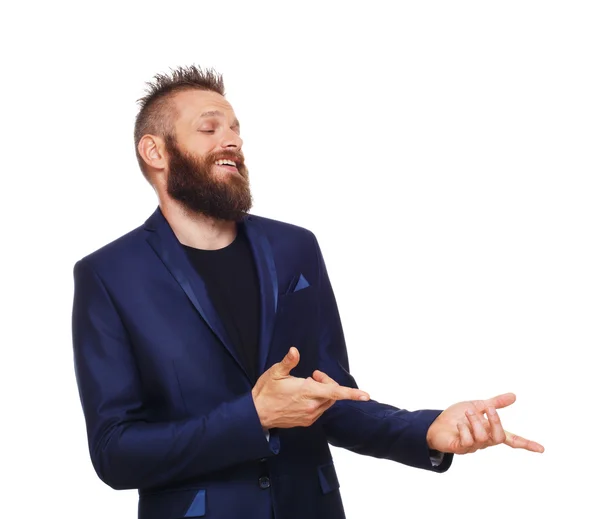 Portret van een jonge man, lachen, met de vingers op iets te wijzen — Stockfoto