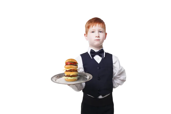 Little boy waiter stands with tray serving hamburger, isolated — Stock Photo, Image