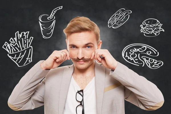 Handsome man and fast food temptation — Stock Photo, Image