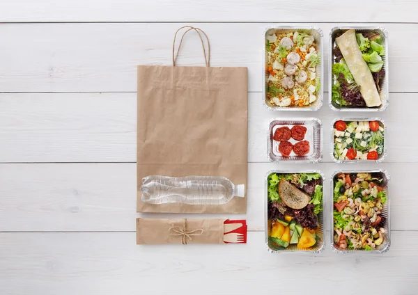 Healthy food take away in boxes, top view at wood — Stock Photo, Image