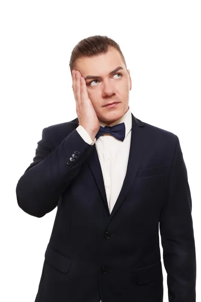 Young worried well-dressed man portrait isolated at white — Stock fotografie