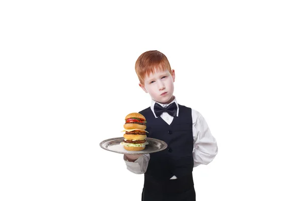 Little sad boy waiter stands with tray serving hamburger — Stock Photo, Image