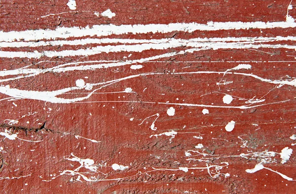 Gesztenyebarna betonfal fehér festékkel csöpög, csepp, és foltok — Stock Fotó