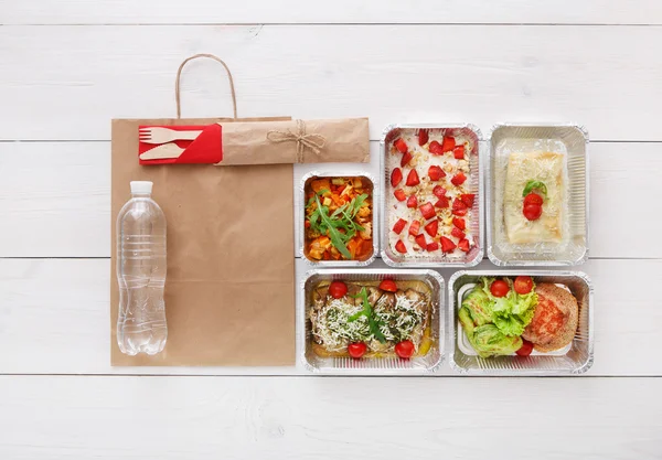 Healthy food take away in boxes, top view at wood — Stock Image Healthy food take away in boxes, top view at wood Royalty Free Stock Images