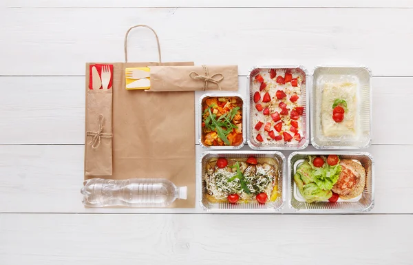 Healthy food take away in boxes, top view at wood — Stock Photo, Image