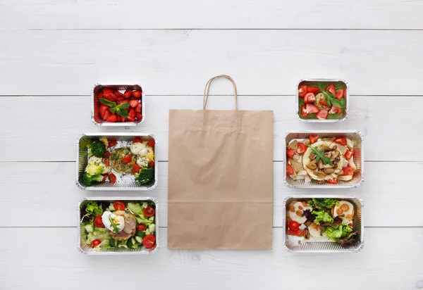 Healthy food take away in boxes, top view at wood — Stock Image Healthy food take away in boxes, top view at wood Stock Image