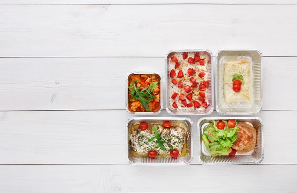 Healthy food take away in boxes, top view at wood — Stock Photo, Image