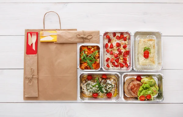 Healthy food take away in boxes, top view at wood — Stock Image Healthy food take away in boxes, top view at wood Stock Picture