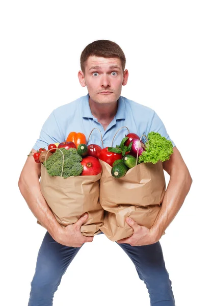 Mutlu bir adam tutmak sağlıklı gıda, izole bakkal alıcı ile çanta — Stok fotoğraf