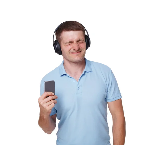 Šťastný mladý muž se sluchátky s hlasitým zvukem — Stock fotografie