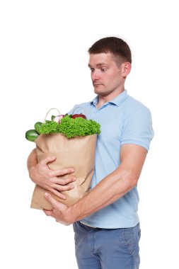 Mutlu bir adam tutmak sağlıklı gıda, izole bakkal alıcı ile çanta