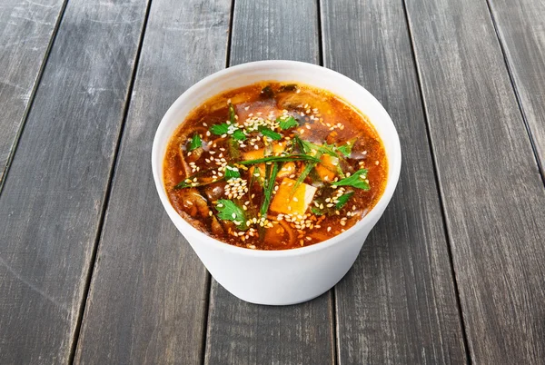 Hot food delivery - miso soup at wood — Stock Photo, Image