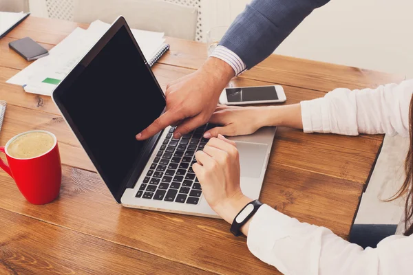 Businessman supervising secretary work on laptop, closeup of hands, unrecognizable — Stock Photo, Image