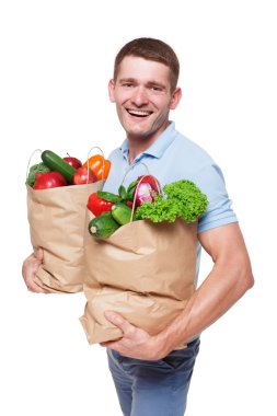 Mutlu bir adam tutmak sağlıklı gıda, izole bakkal alıcı ile çanta