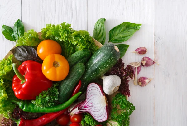 Border of fresh vegetables on wooden background with copy space — Stock Photo, Image