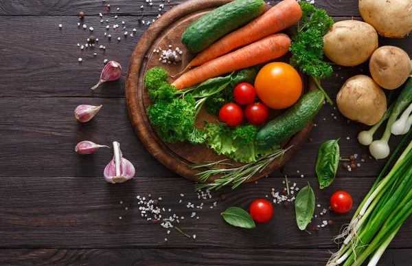 Plenty of fresh vegetables on wooden background with copy space — Stock Photo, Image