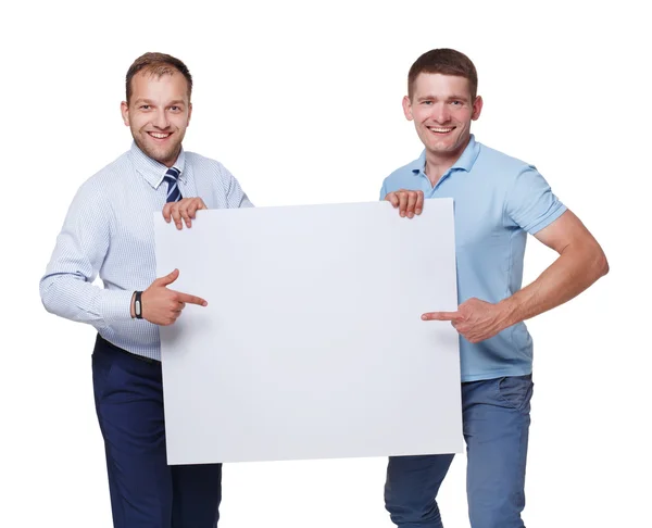 Dos hombres de negocios llevan y muestran el tablero de publicidad en blanco, aislado — Foto de Stock