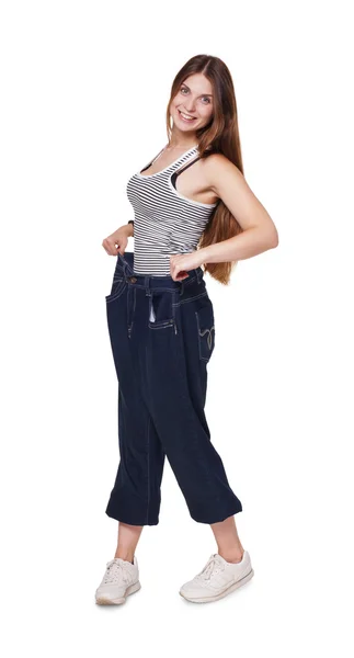 Νεαρή γυναίκα ευτυχισμένη από αποτελέσματα δίαιτα απώλειας βάρους, απομονωμένη — Φωτογραφία Αρχείου