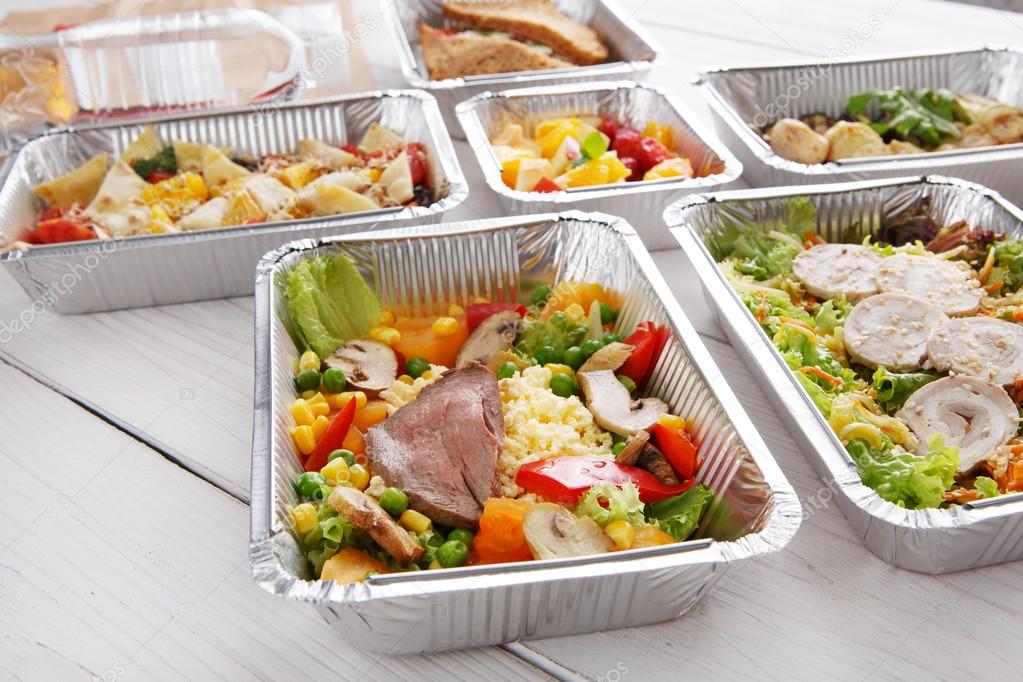 Healthy food in foil boxes, diet concept.