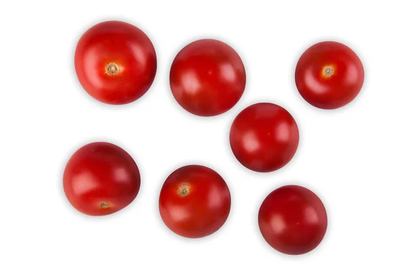 Reife rote Kirschtomaten verstreut, isoliert auf weißem Hintergrund — Stockfoto