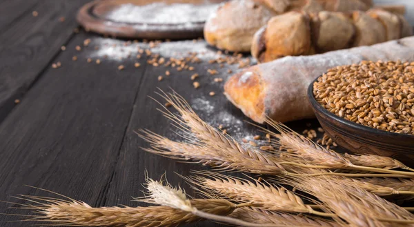 Bread bakery background. Brown and white wheat grain loaves composition