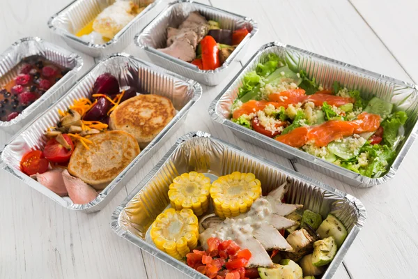 Healthy food take away in boxes, top view at wood — Stock Photo, Image