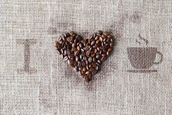Love to coffee - Texture de toile de jute en forme de coeur de haricots — Photo