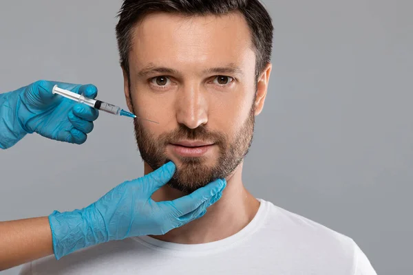 Closeup of middle-aged man getting anti-aging procedure — Stock Photo, Image