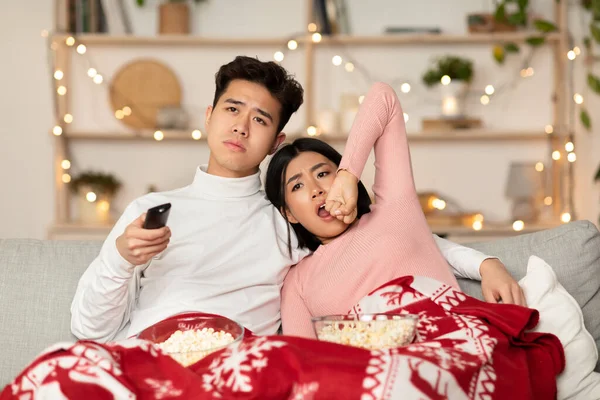 Joyful Asian Boyfriend And Girlfriend Playing Video Game At Home