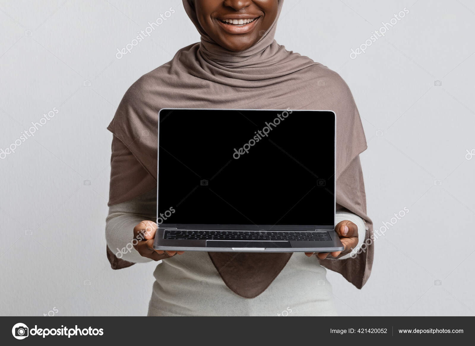 Download Mockup Of African Muslim Lady In Hijab Holding Laptop With Black Screen Stock Photo By C Milkos 421420052