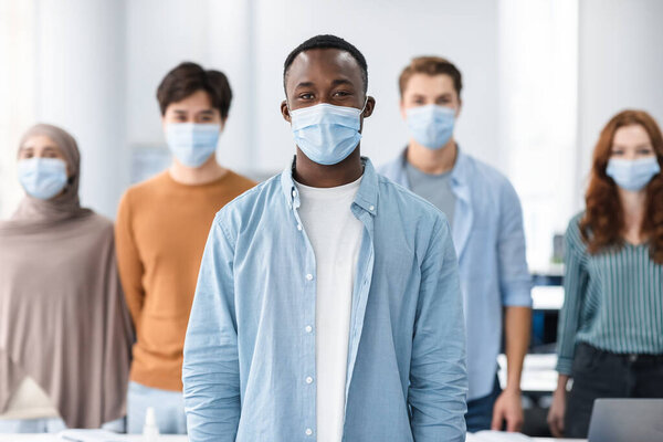 Diverse group of international people wearing medical masks