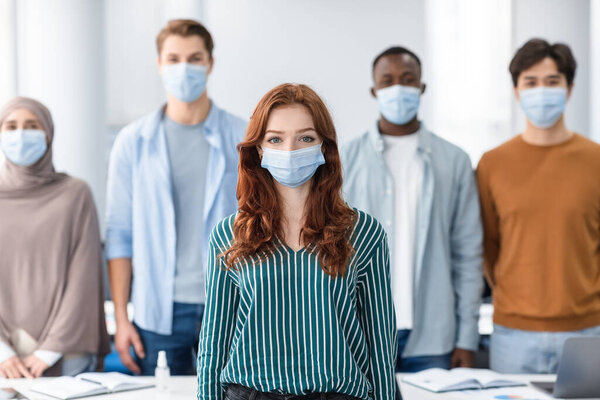 Diverse group of international people wearing medical masks