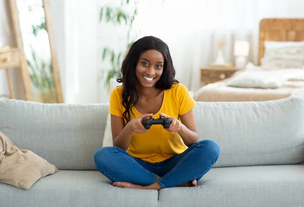 Having Fun at Home. Cheerful Black Teen Guy with Joystick Playing Online  Computer Games, Sitting on Couch Indoors Stock Image - Image of computer,  person: 227478857