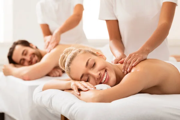 Relaxed Couple Receiving Back Massage Treatment Lying At Spa Resort — Stock Photo, Image