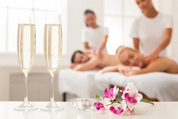 Relaxed Couple Enjoying Back Massage Indoor, Focus On Champlagne Glasses — Stock Photo, Image