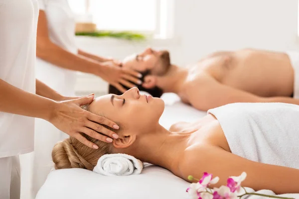 Couple Receiving Head Massage Relaxing With Eyes Closed Indoors — Stock Photo, Image