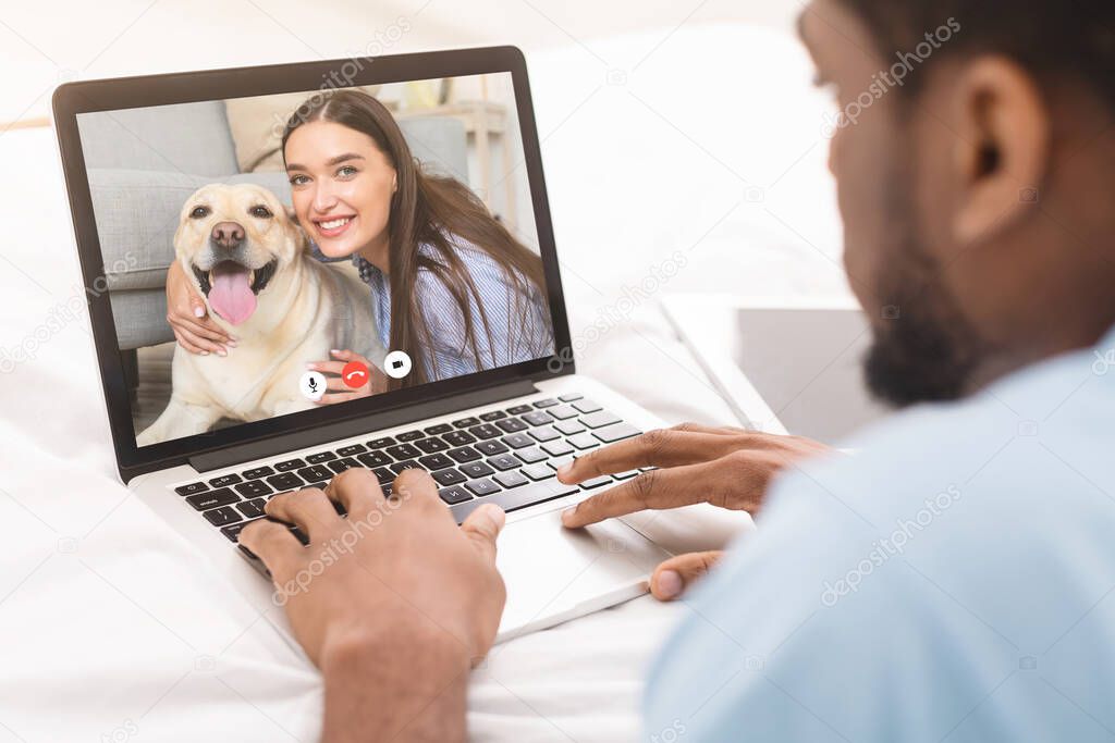 Diverse Dating Couple Having Video Call Via Laptop At Home