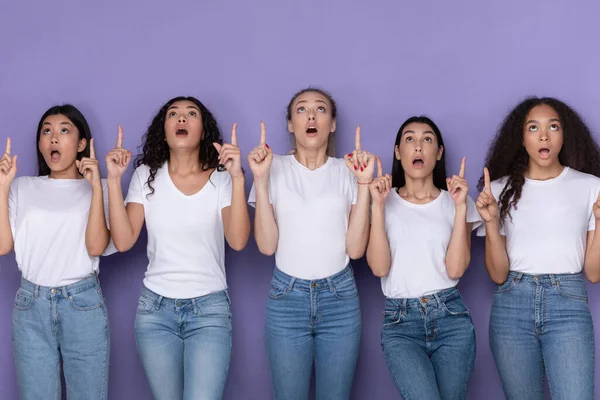 Five Amazed Ladies Pointing Fingers Up Standing Over Purple Background — Stock Photo, Image
