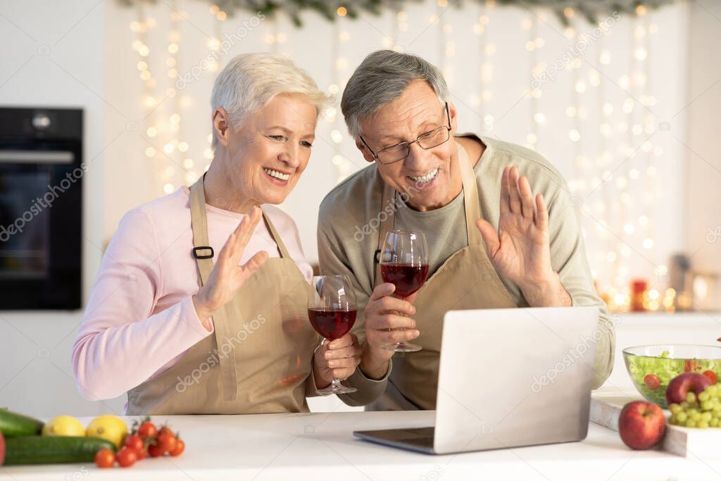 Senior Couple Making Video Call Celebrating Christmas At Home