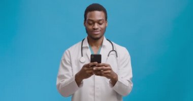 Online medical consultation. Studio shot of young african american doctor chatting with patient, prescribing treatment