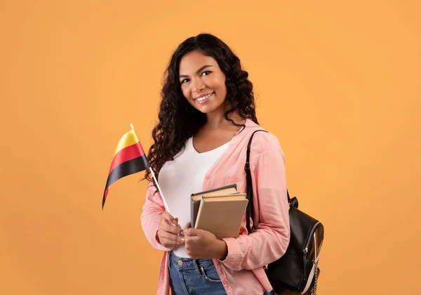 Student from Germany and learning new language. Smiling mixed race teen woman in casual — Stock Photo, Image