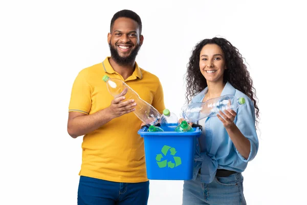 Diverse Couple Holding Box for Recycling Plastic Bottles, White Background — стокове фото