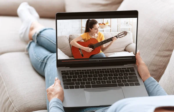 Unrecognizable young woman watching online music lesson, learning how to play guitar on web from home, collage