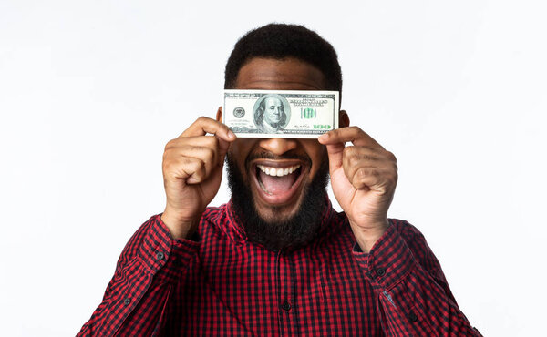 Happy Black Man Holding One 100 Dollar Banknote, White Background
