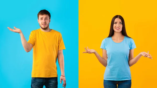 Confused puzzled young couple shrugging at studio