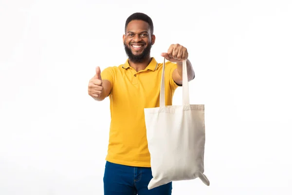African Man Showing Eco Bag Gesturing Thumbs-Up On White Background — Stock Photo, Image